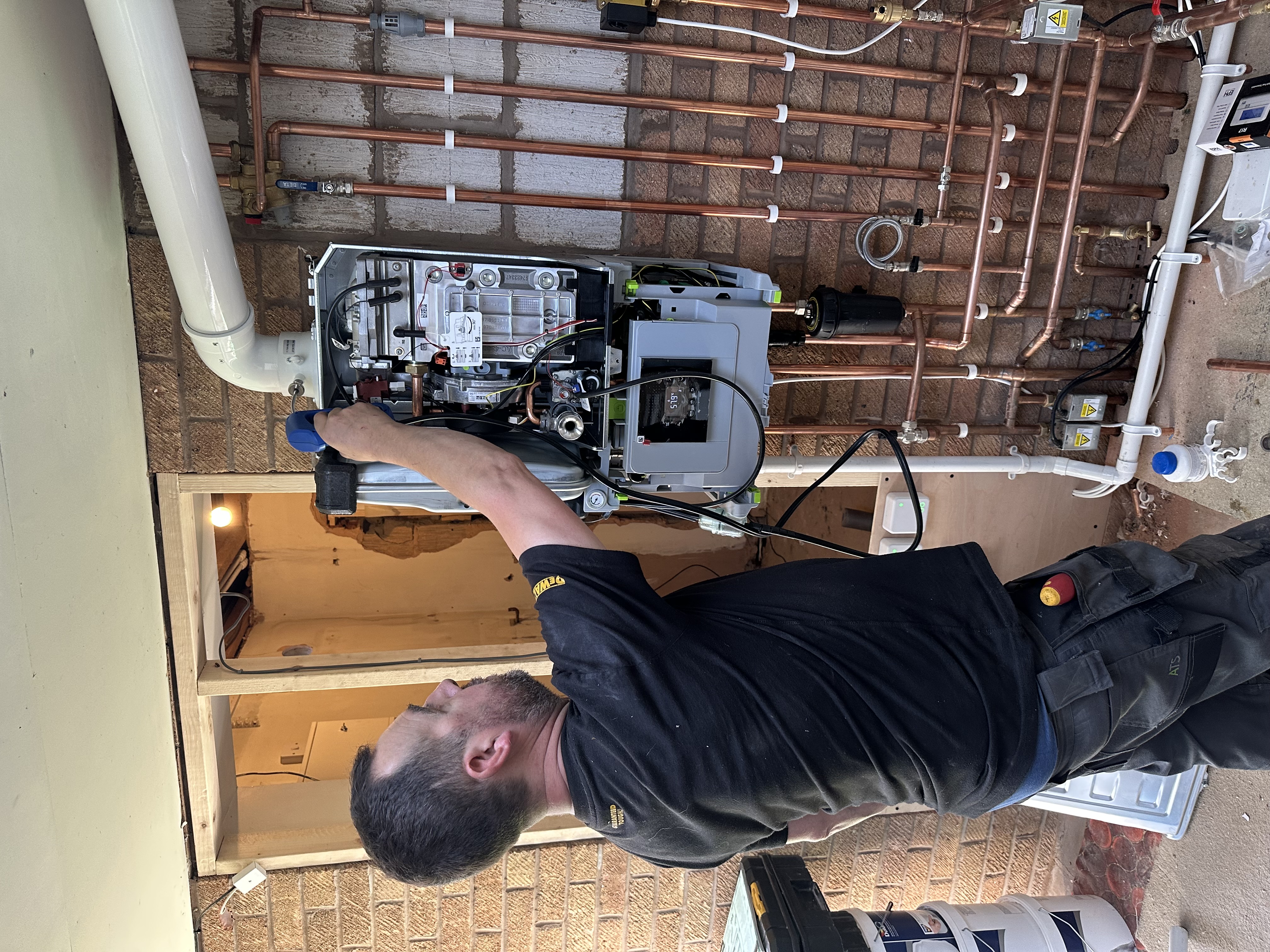 Engineer working on a boiler installation