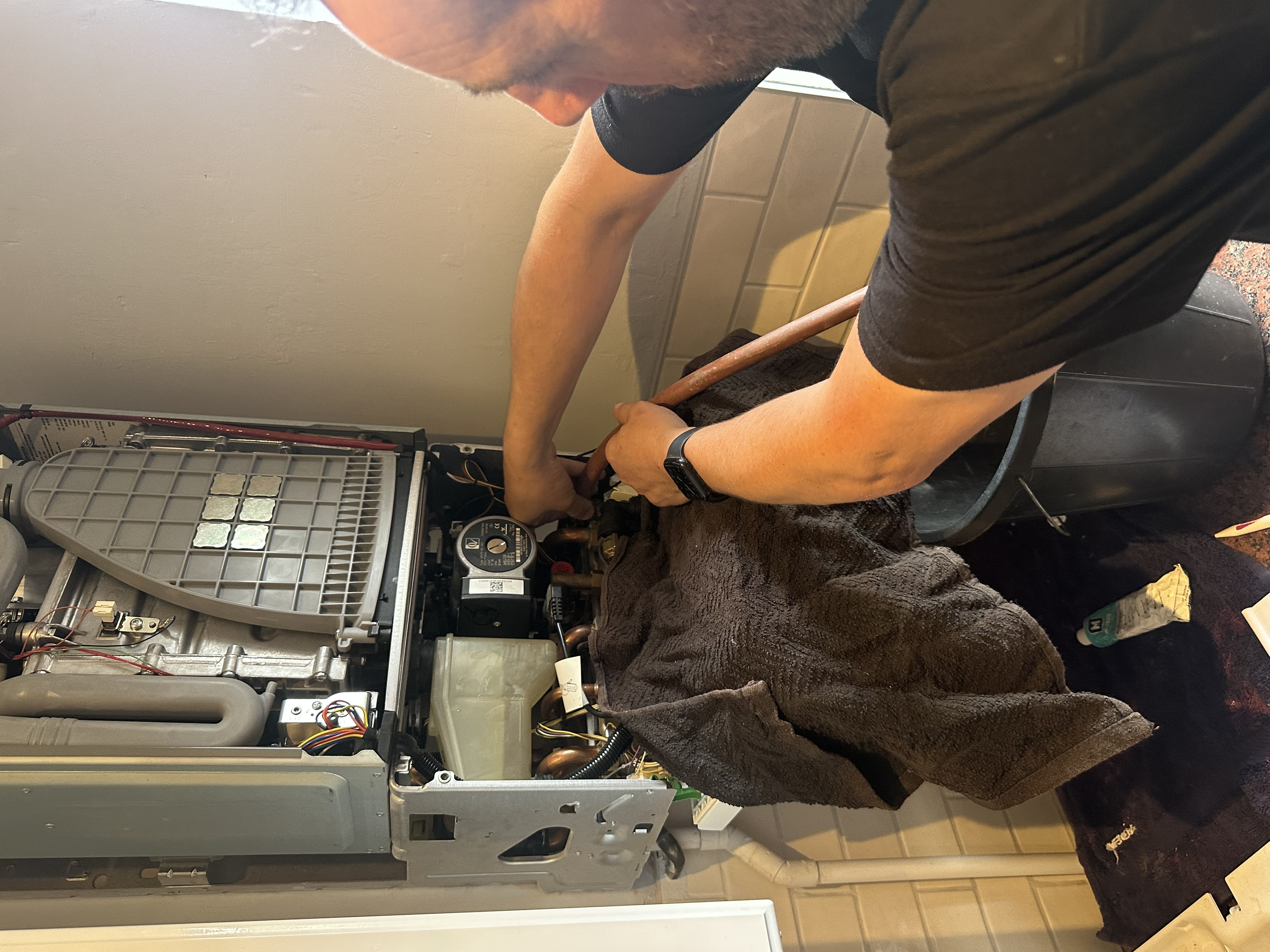 Engineer servicing a boiler